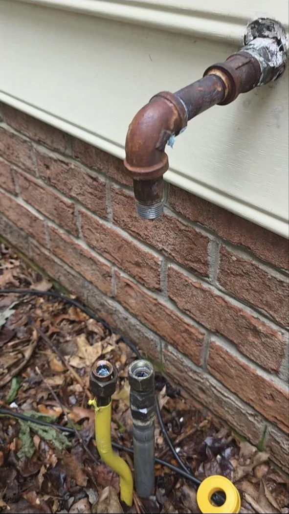 Open rusted gas pipe after the old propane regulator was removed