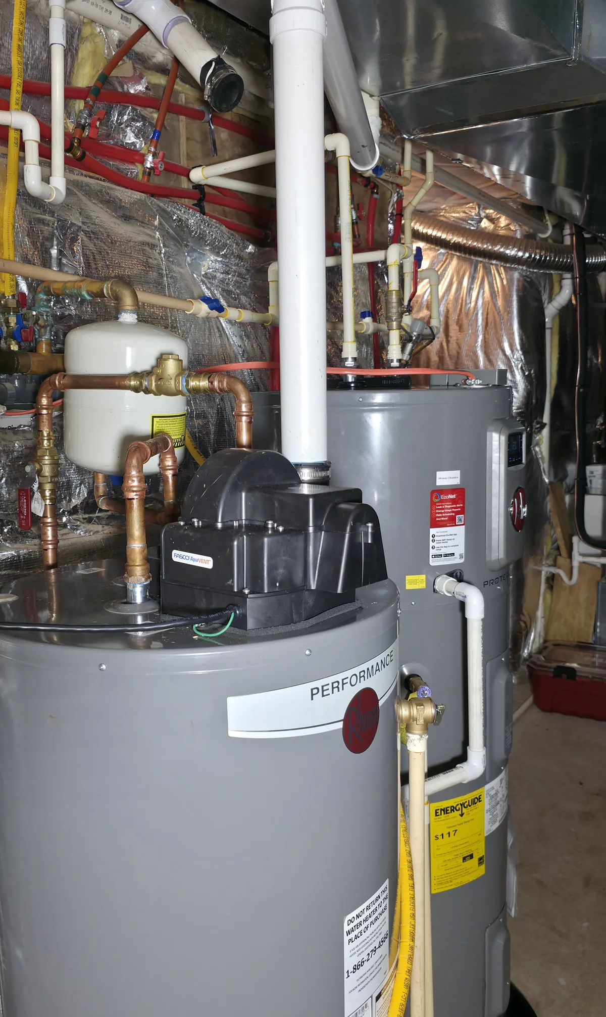 Rheem hybrid heat pump water heater installed in a Westminster, MD basement with a second tank, expansion tank, and condensate pump
