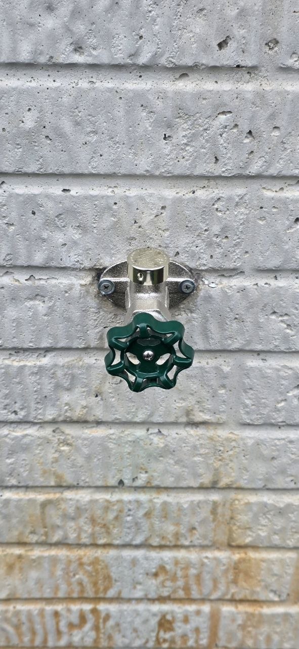New frost-free hose bib installed on an exterior wall