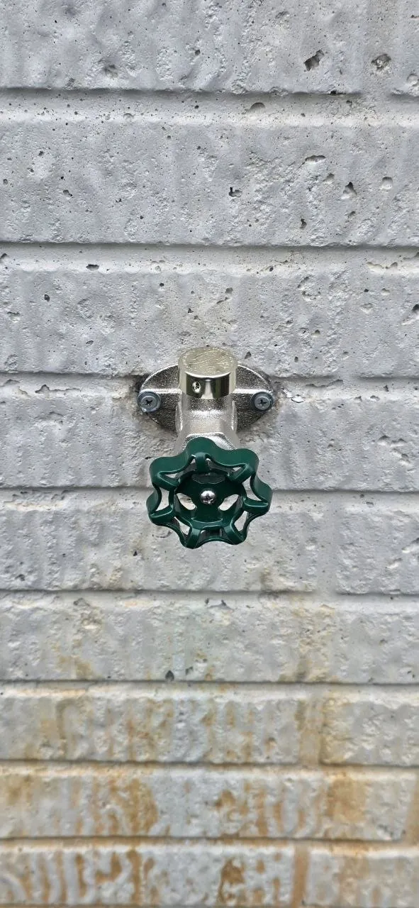 New frost-free hose bib installed on an exterior wall